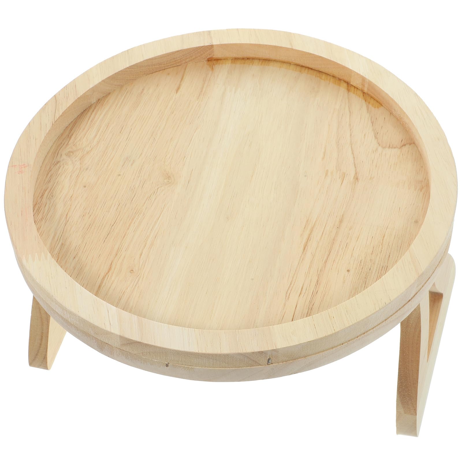 Mesa plegable de madera redonda para evitar caídas junto al sofá del salón