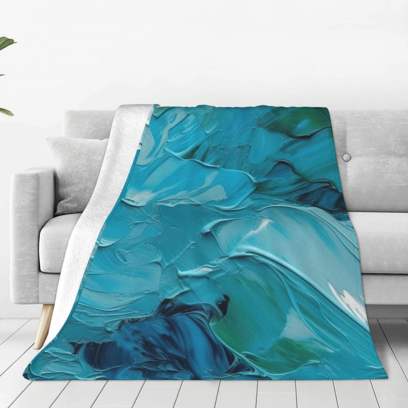 Couverture en micro polaire bleue finis les plaids lourds et rêches grâce à sa douceur légère