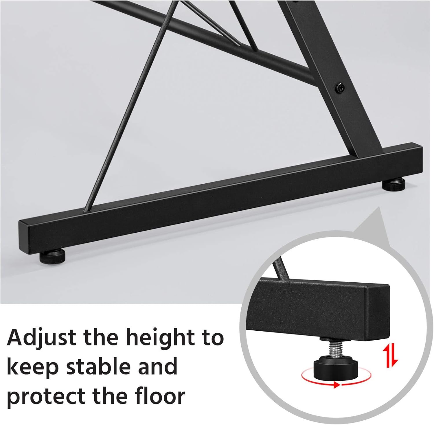 Close-up of an adjustable footpad on the desk leg, with an arrow indicating rotation for adjustment