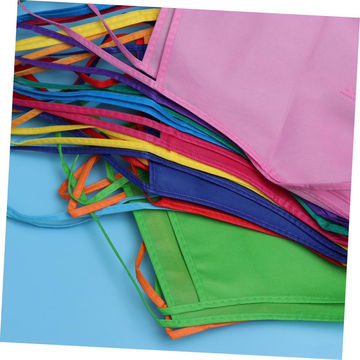 24pcs Boy Girl's Disposable Non-woven Fabric Artist Aprons Boys and Girls Painting Smocks for Art Activities Easy to Clean for Crafts Cooking and Outdoor Fun