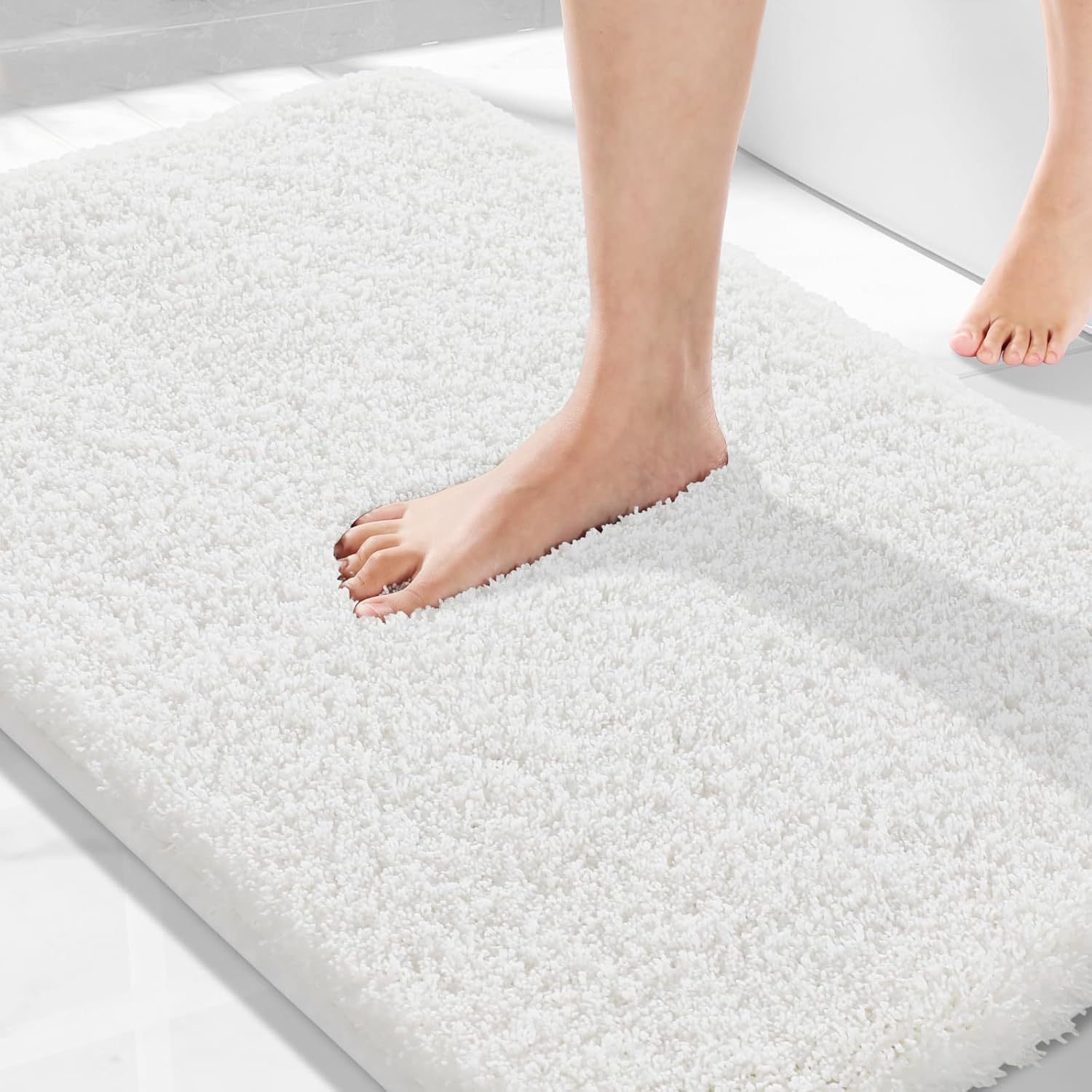 Yimobra Bath Mat, Super Shaggy Soft Comfortable Non Slip, Water Absorbent Microfiber Bath Mat, Dries Quickly, Machine Washable Thick Bathroom Floor Rugs for Shower, 92 x 61 cm, Off White — image 1