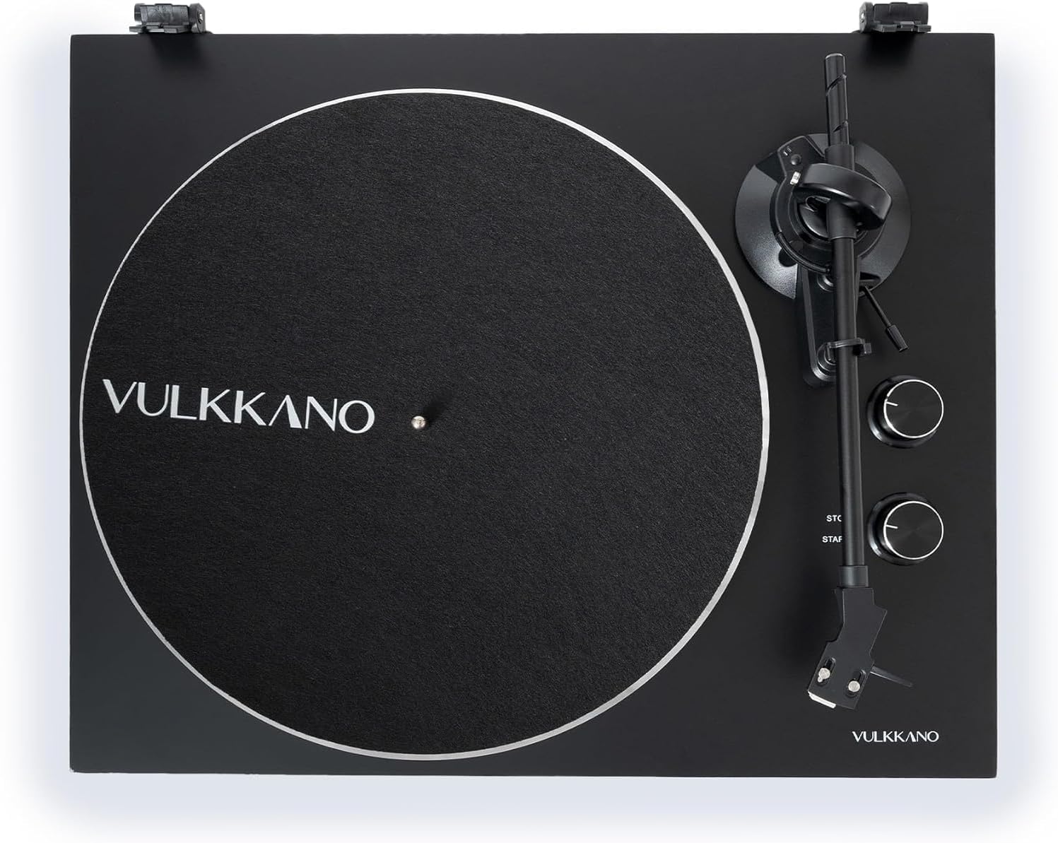 Minn fuq għal isfel view of the VULKKANO TD10 Turntable, showing the platter, tonearm, and control knobs for speed and start/stop.