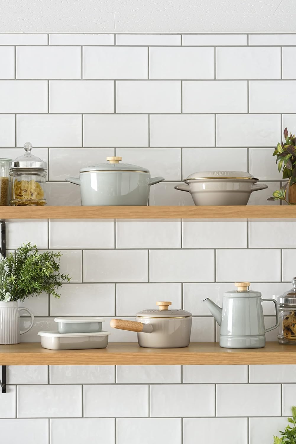 BRUNO Fuji Hollow Kettle in greige color placed on a portable gas stove outdoors, surrounded by other picnic items.