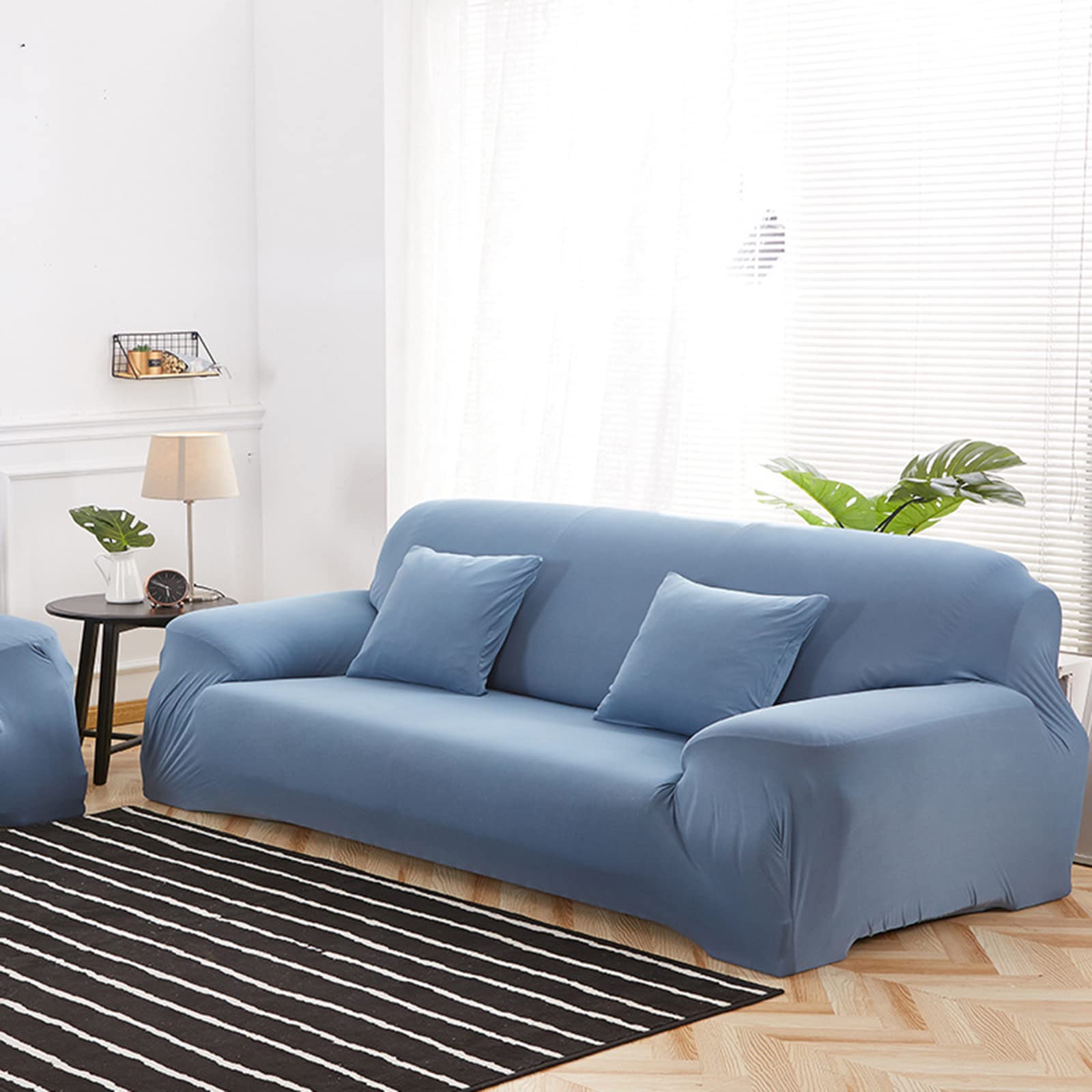 Housse de canapé extensible pour protéger le fauteuil du salon