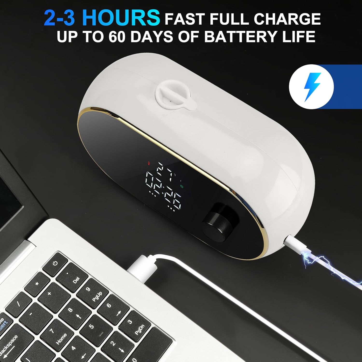 Monstake Automatic Soap Dispenser being charged via USB cable connected to a laptop.