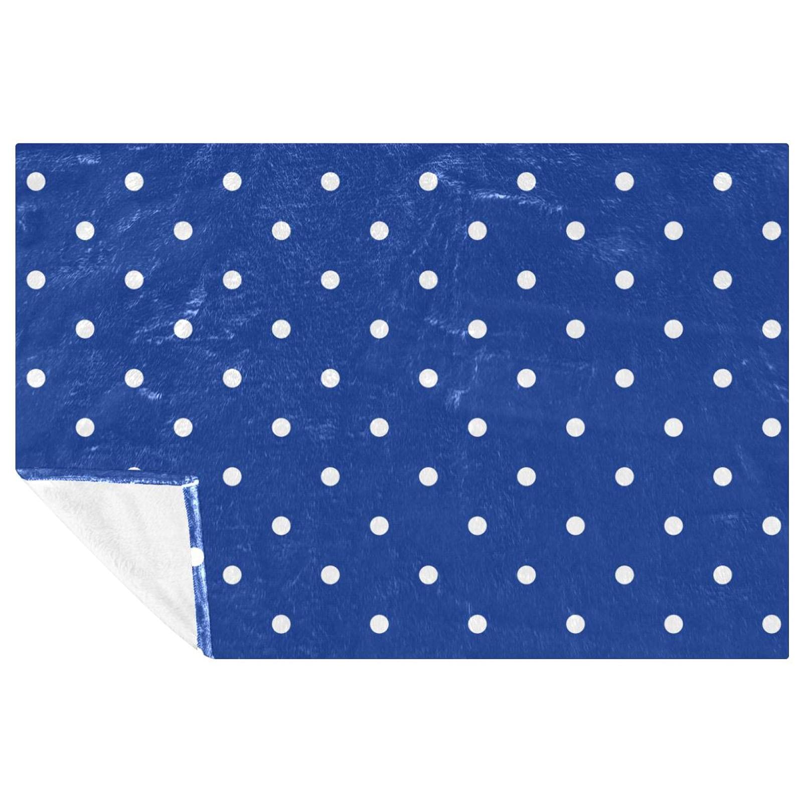 Couverture douce à pois bleus et blancs pour des instants cocooning au lit