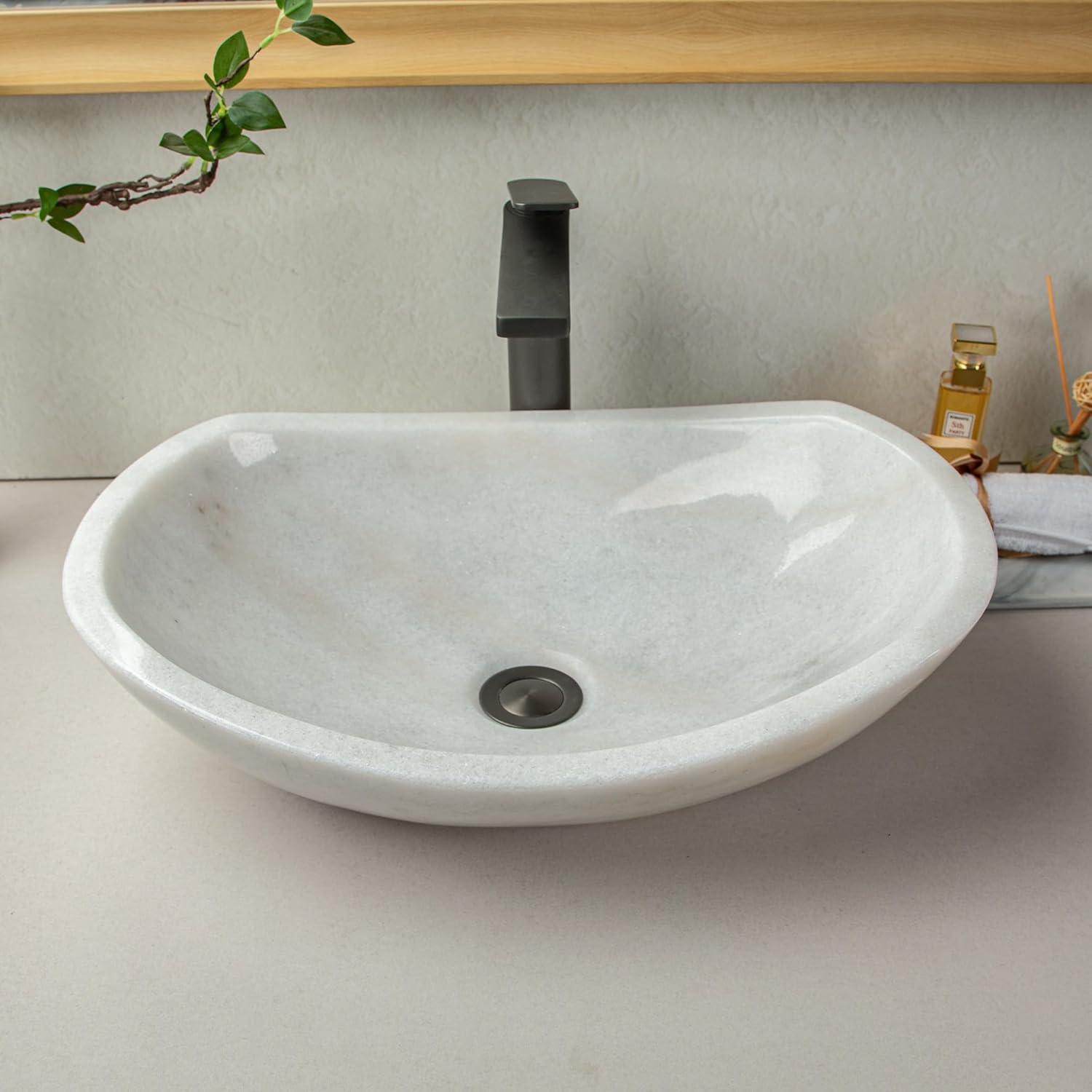 Natural white marble boat-shaped sink with irregular natural brown/black veining, 100% handcrafted. Bathroom vanity sink—elegant and refined, suitable for bathroom vanities or countertops.