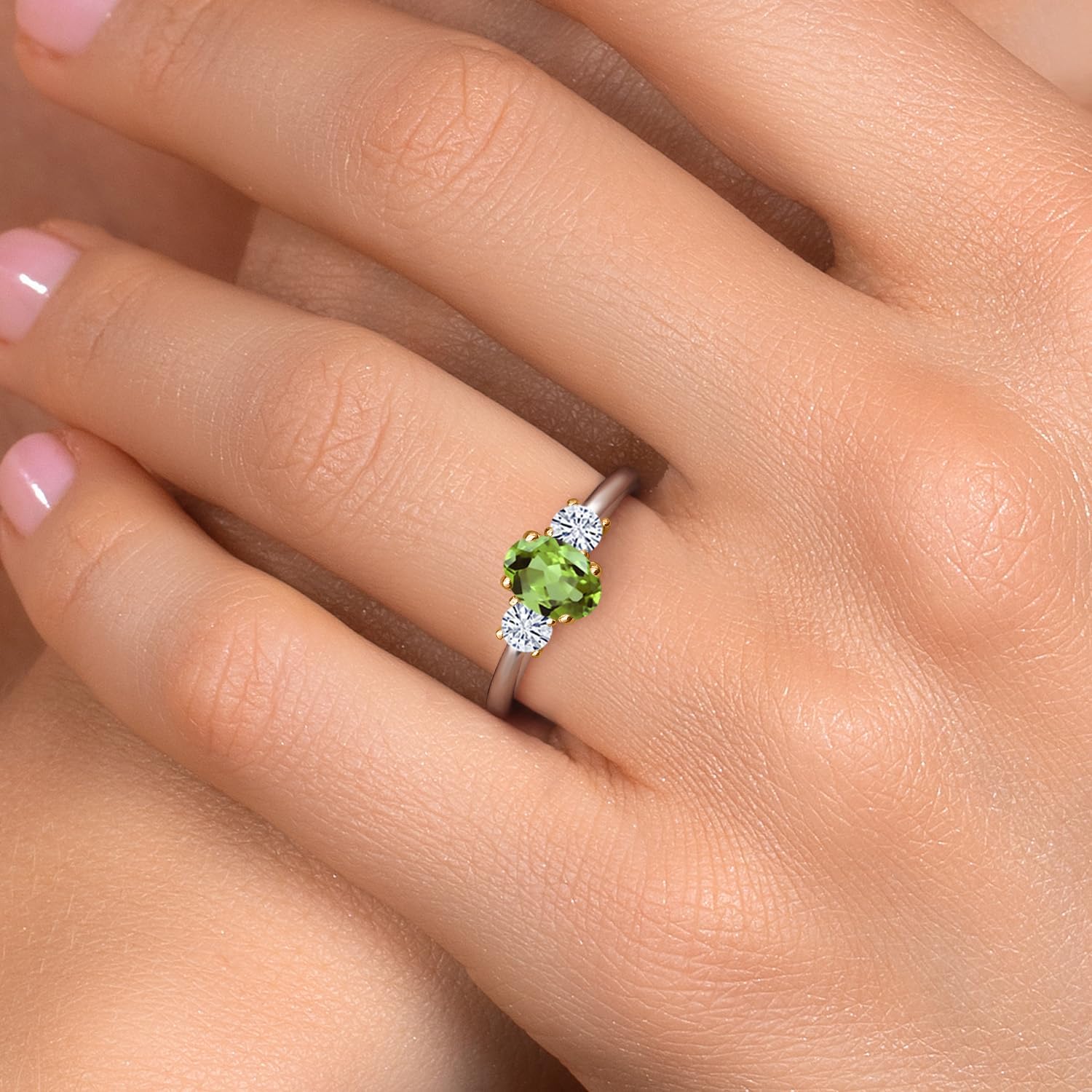 Gem Stone King 10K 2 Tone Gold Green Peridot and White Moissanite 3-Stone Engagement Ring For Women | 1.22 Cttw | Oval 7X5MM and Round 3.5MM