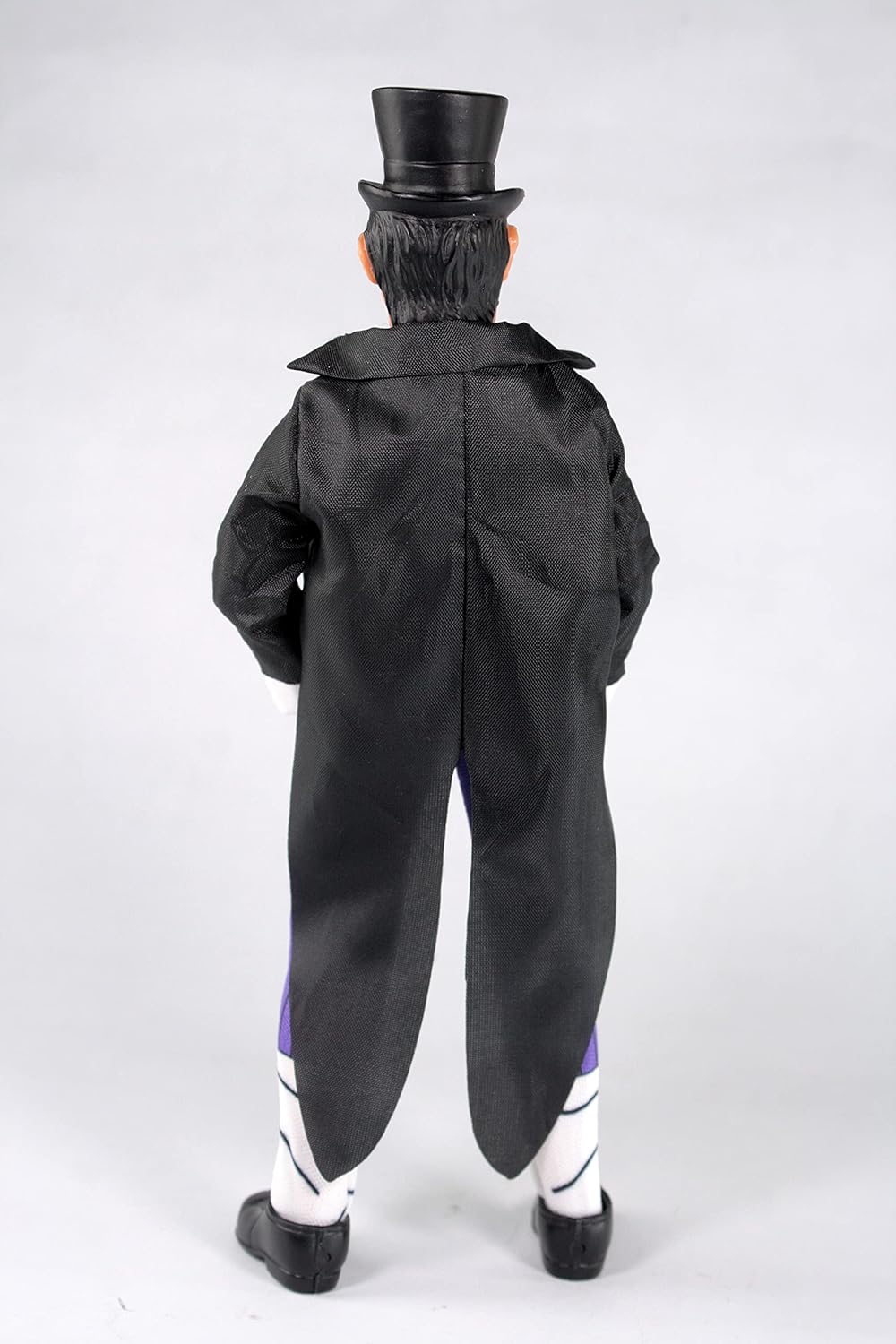 Mego DC Penguin action figure in a dynamic pose, adjusting his hat