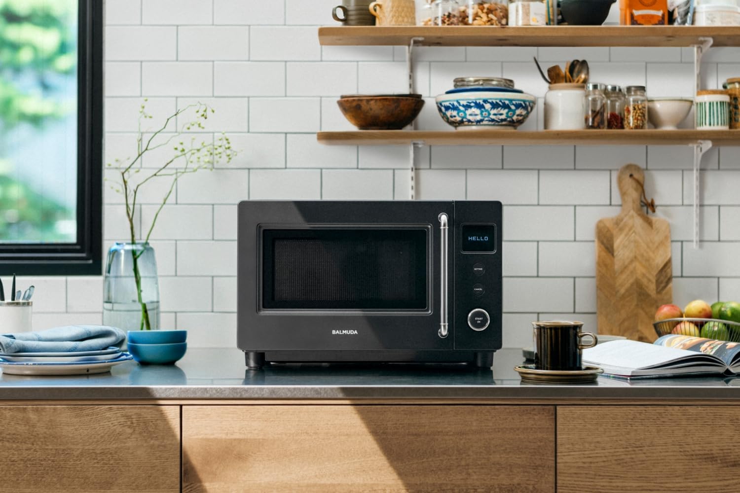 Hand gently closing the microwave door