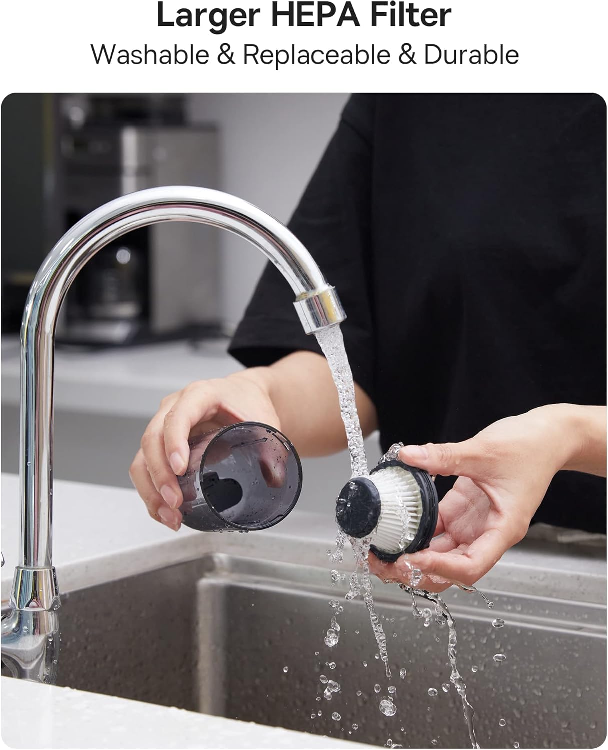 A person cleaning the washable HEPA filter under running water.