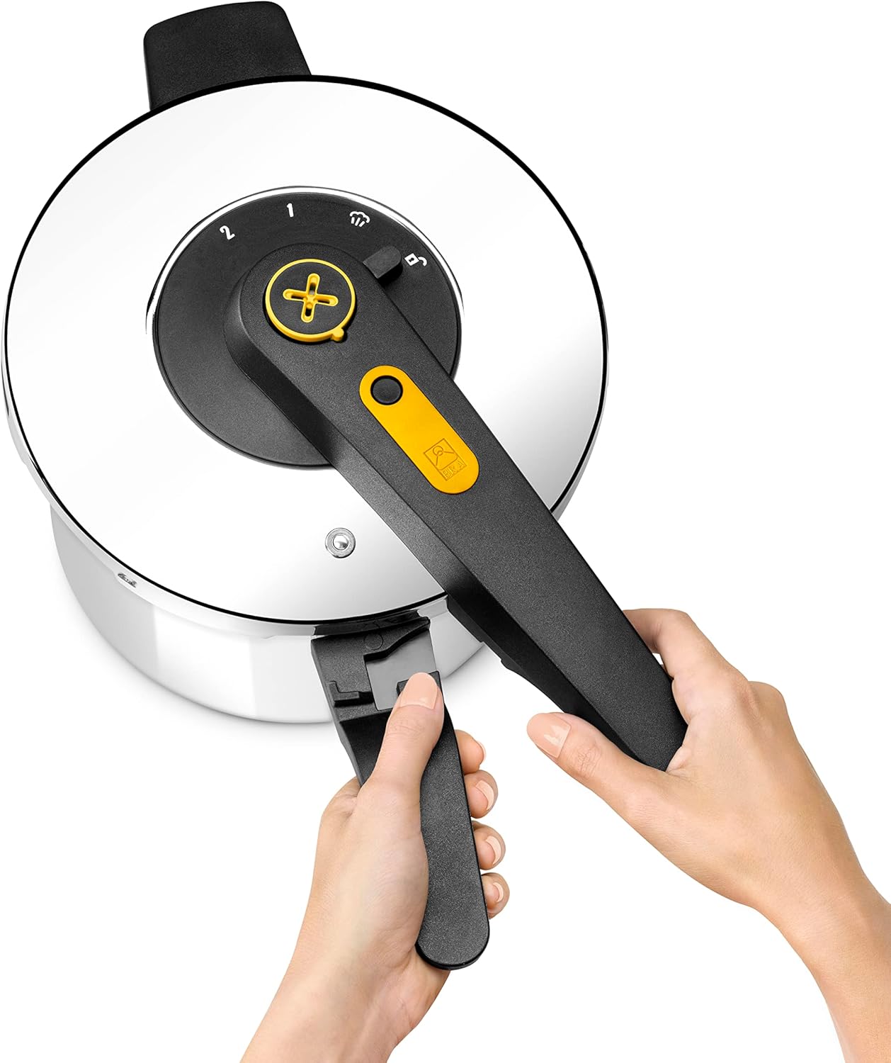 Underside of pressure cooker lid showing gasket and valves