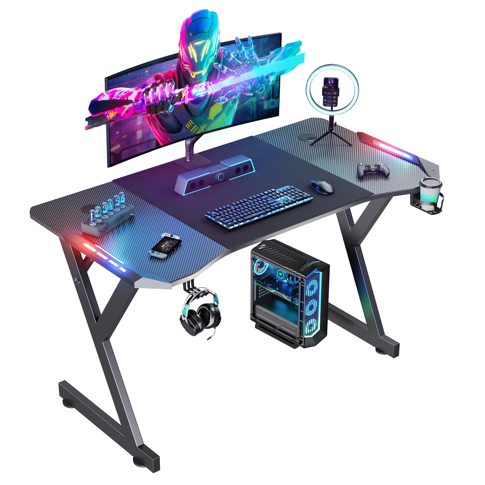Mesa Gaming 120cm x 60cm, Ergonómico Mesa Gamer con LED, Escritorio con Tablero de Fibra de Carbono, Desk para Computadora con Portavasos y Gancho para Auriculares, Negro
