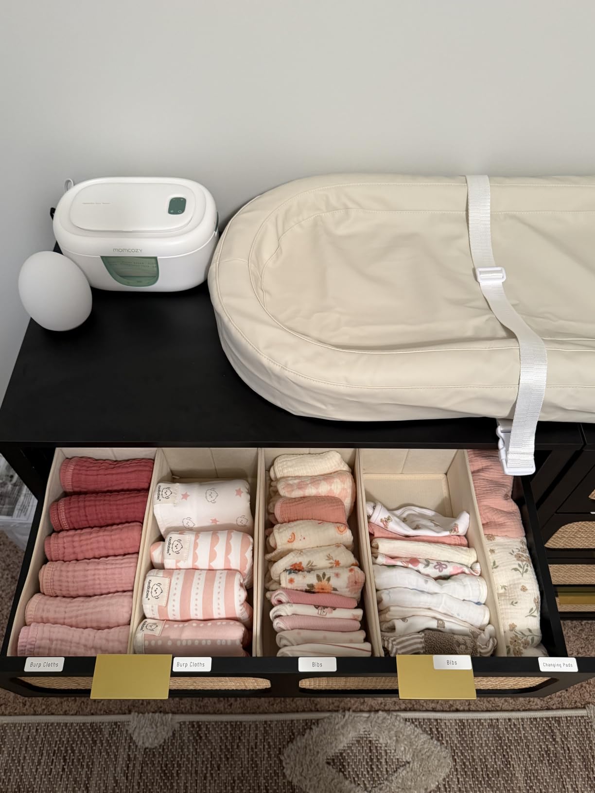 Drawer divided into small compartments for baby socks and small items