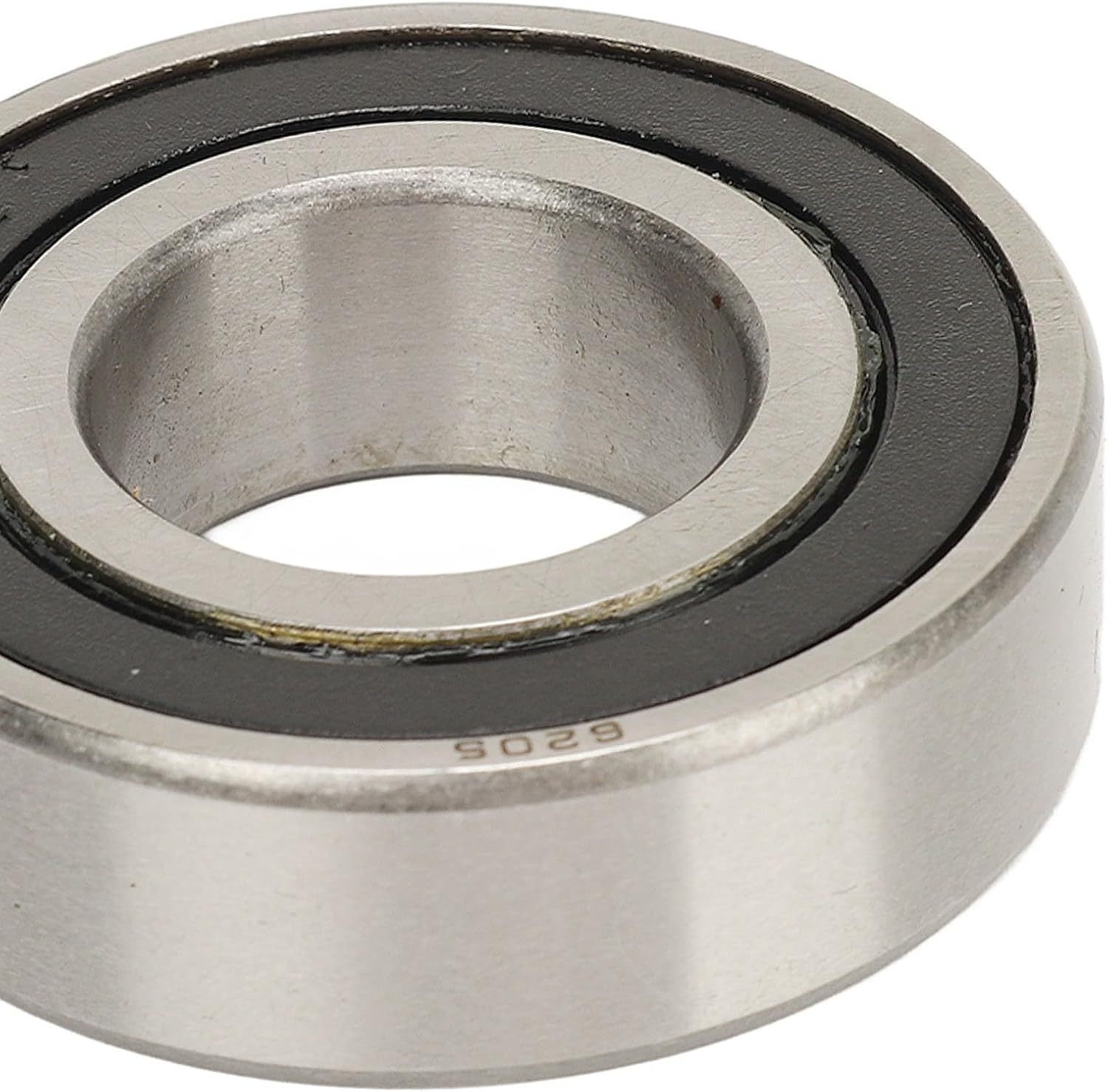 Close-up view of a new metal axle bearing with '9029' marking