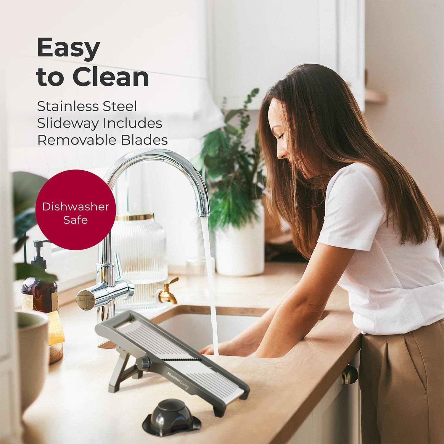 Woman rinsing mandoline slicer under running water