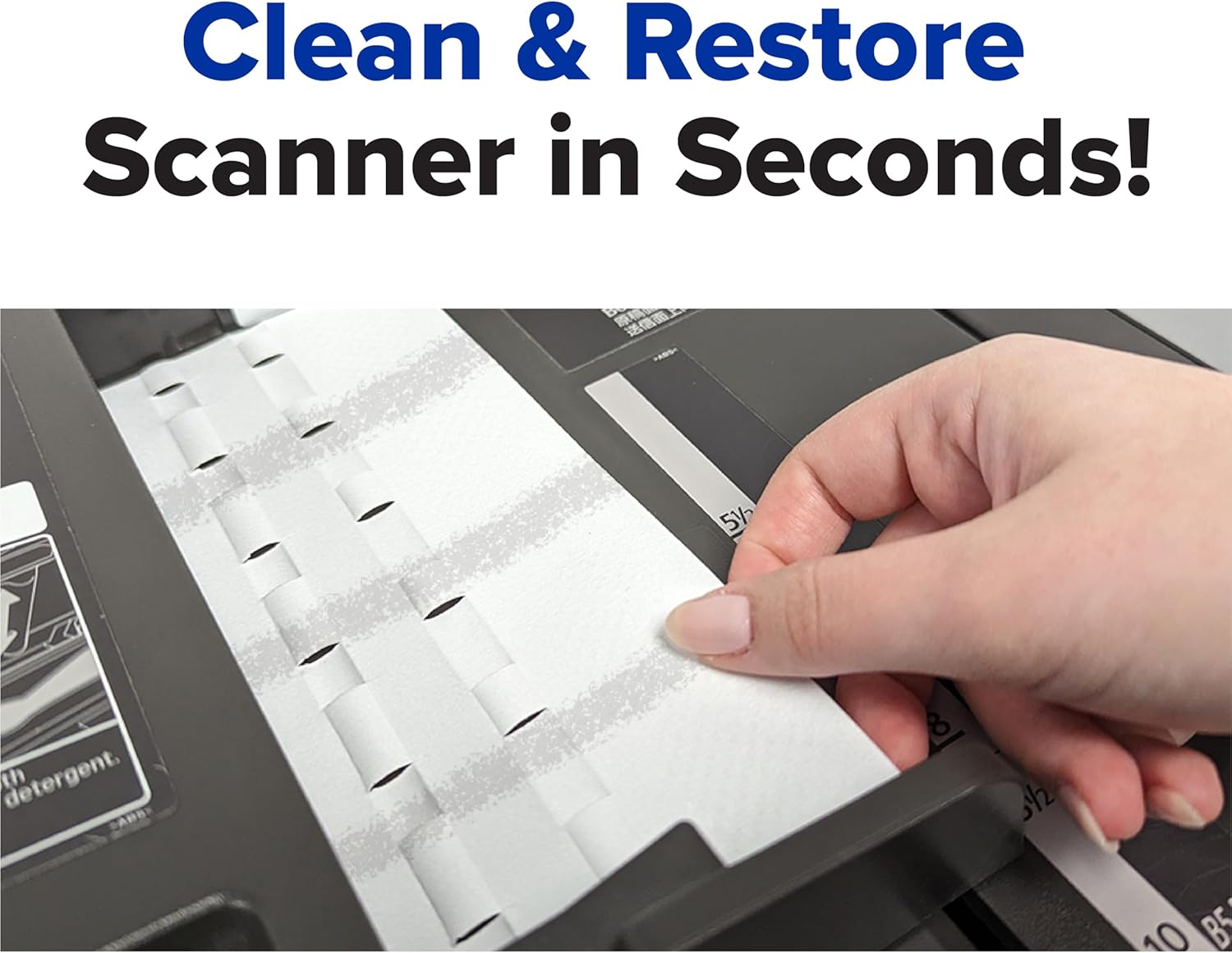 Hand inserting cleaning card into a document scanner