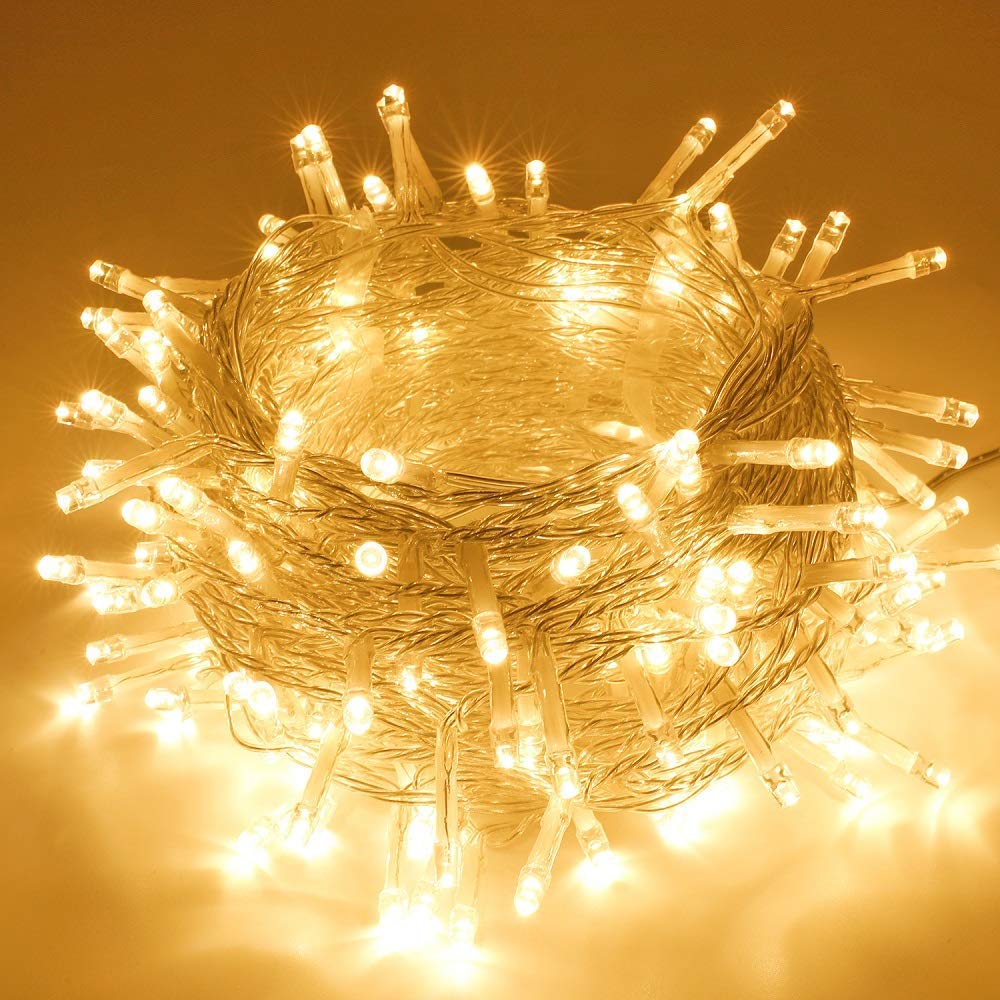 Coiled SANJICHA Extra-Long String Lights with the attached UL certified power adapter visible.