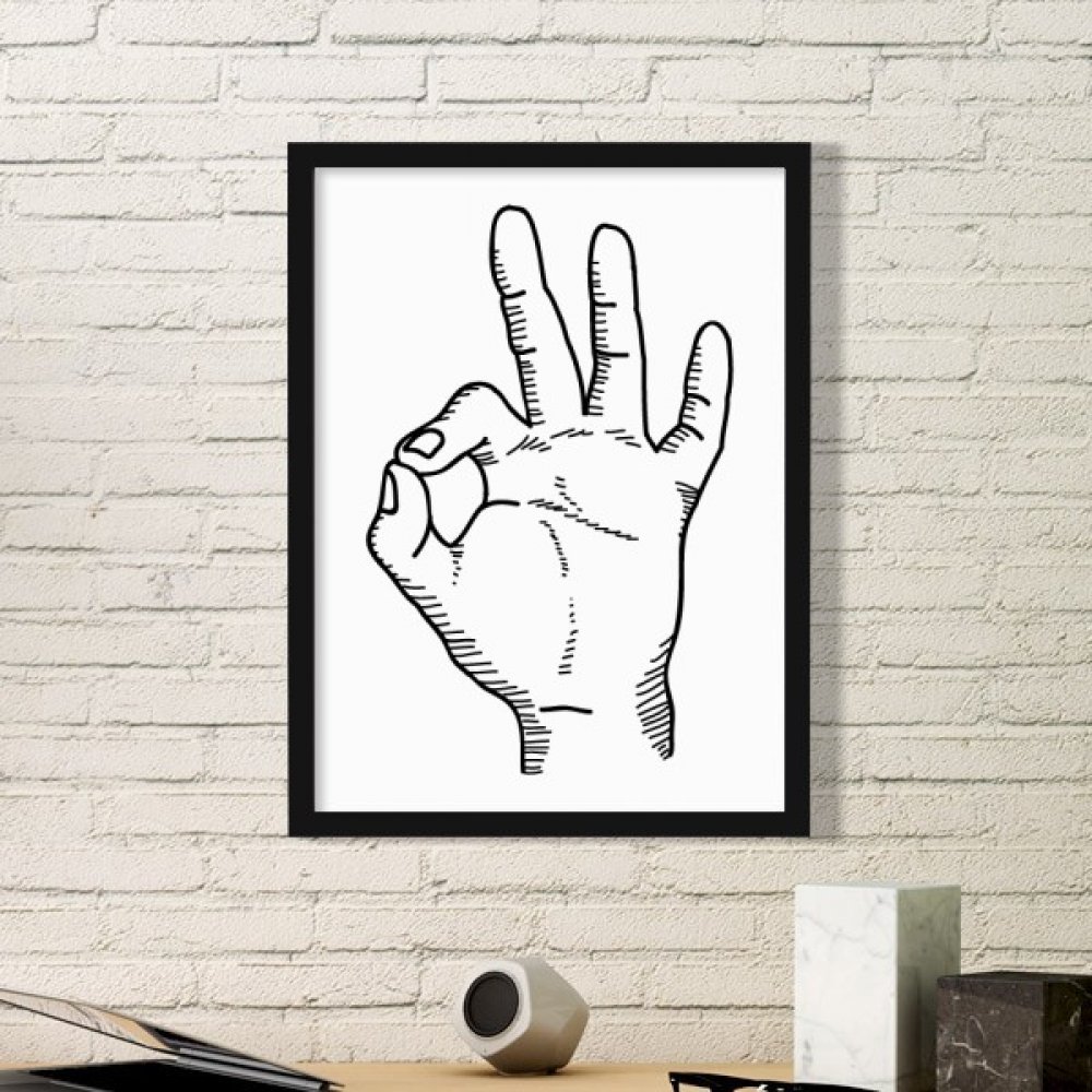 Cadre photo noir en bois motif dessin geste OK pour habiller un mur vide