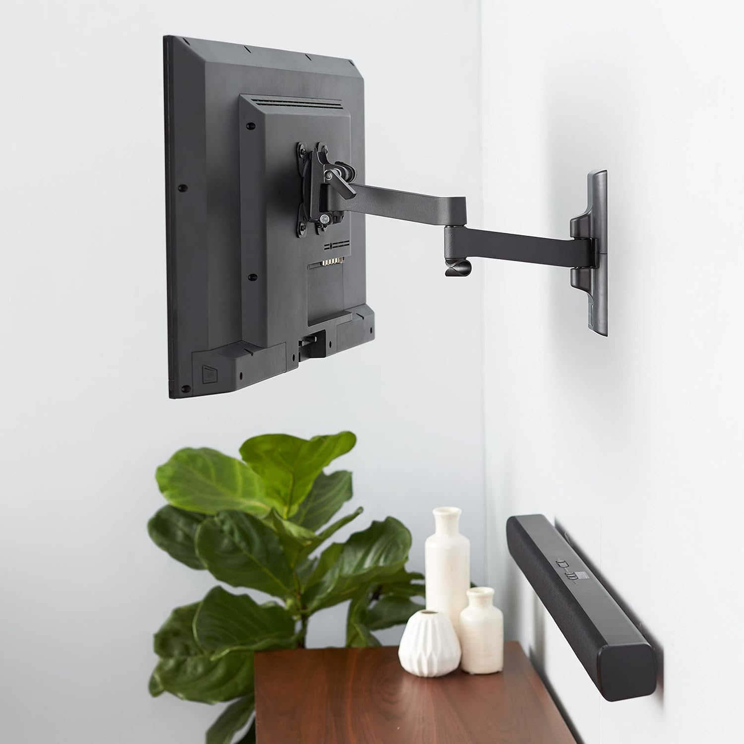 AmazonBasics TV Wall Mount installed with a television in a living space.