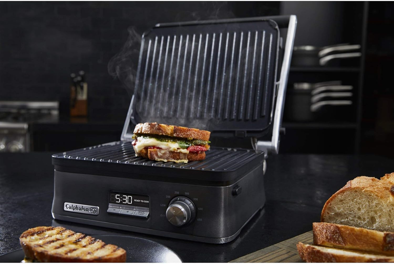 Calphalon Even Sear Indoor Electric Multi-Grill cooking a grilled cheese sandwich in contact grill mode.