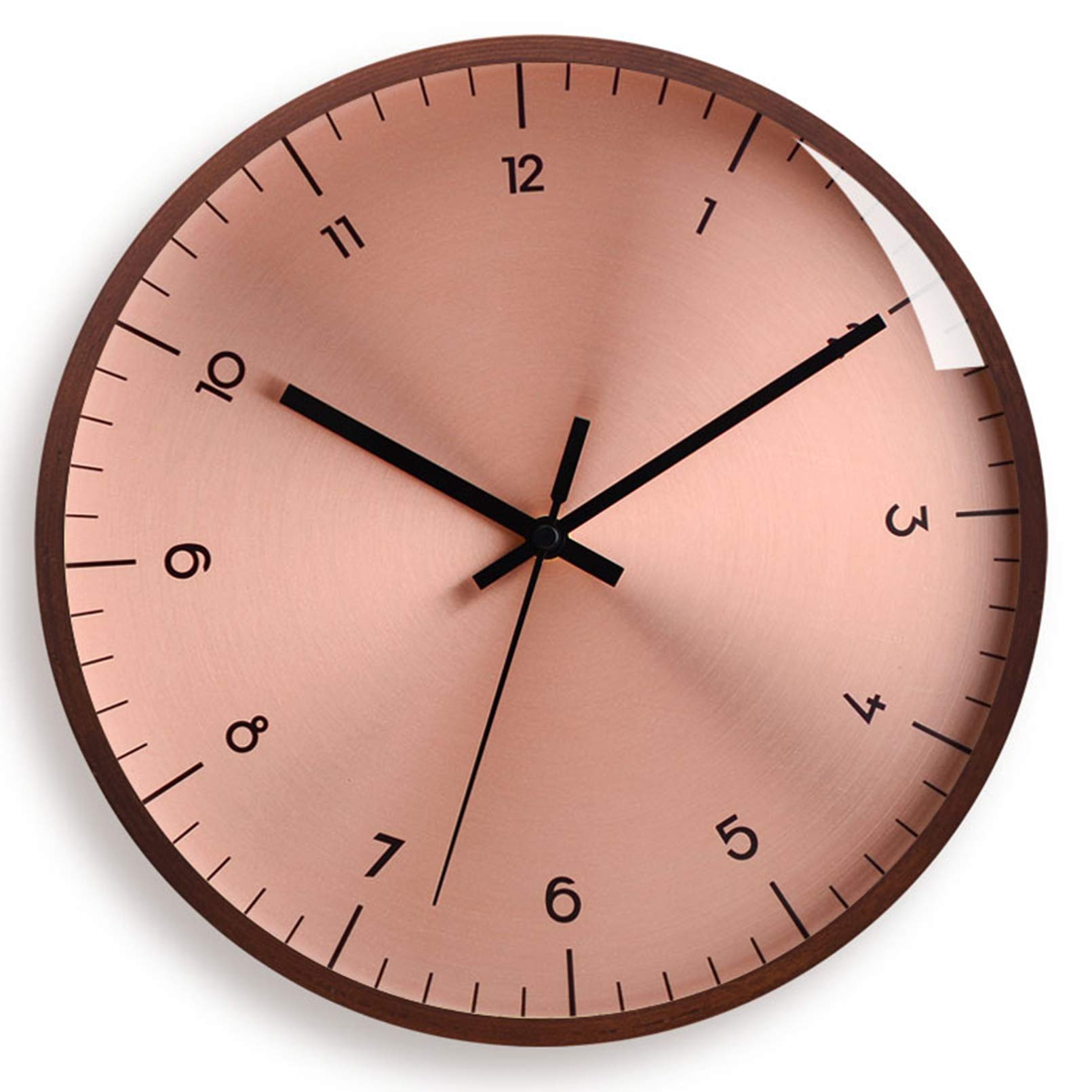 Horloge murale au design d'art or rose pour sublimer le salon