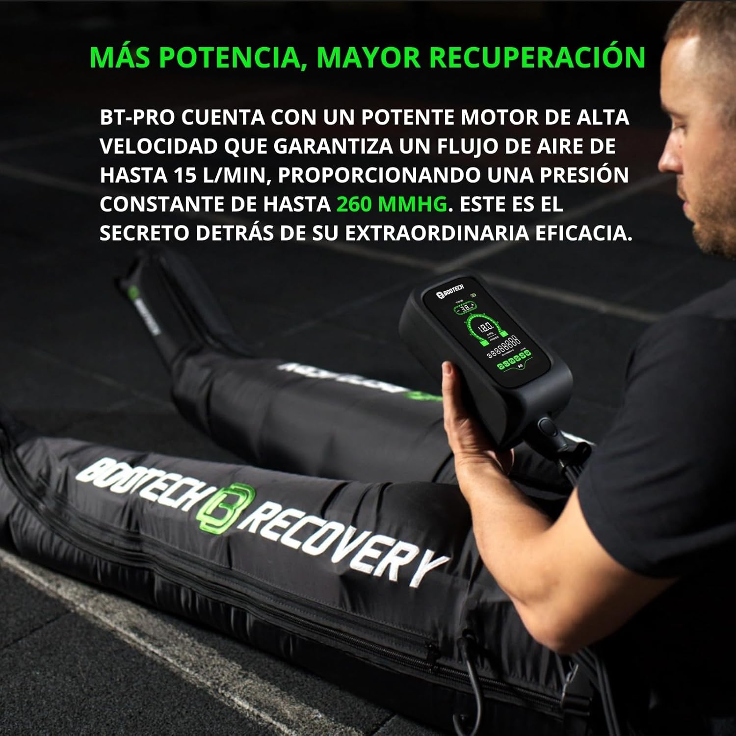 Person wearing BOOTECH pressotherapy pants and adjusting the control unit