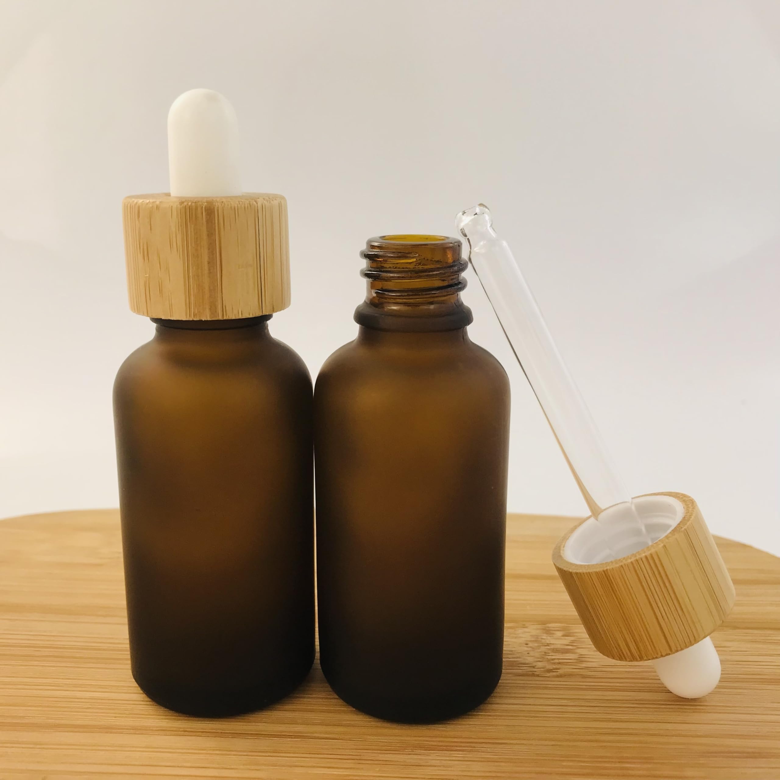 Gotero Botellas líquidas de aromaterapia vidrio cuentagotas esmerilado for aceite masaje esencial recarga pipeta tapa madera(Clear,Black top head,5x 100ml)