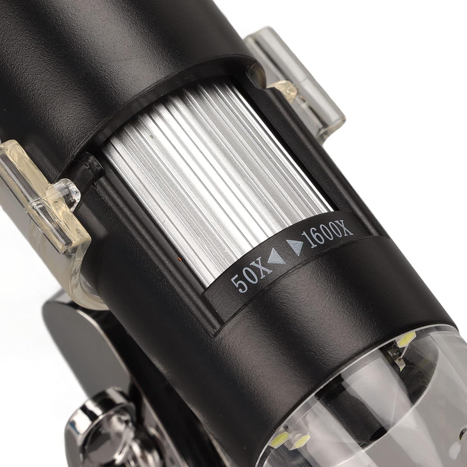 Close-up of the microscope body showing the magnification adjustment dial with markings from 50X to 1600X.