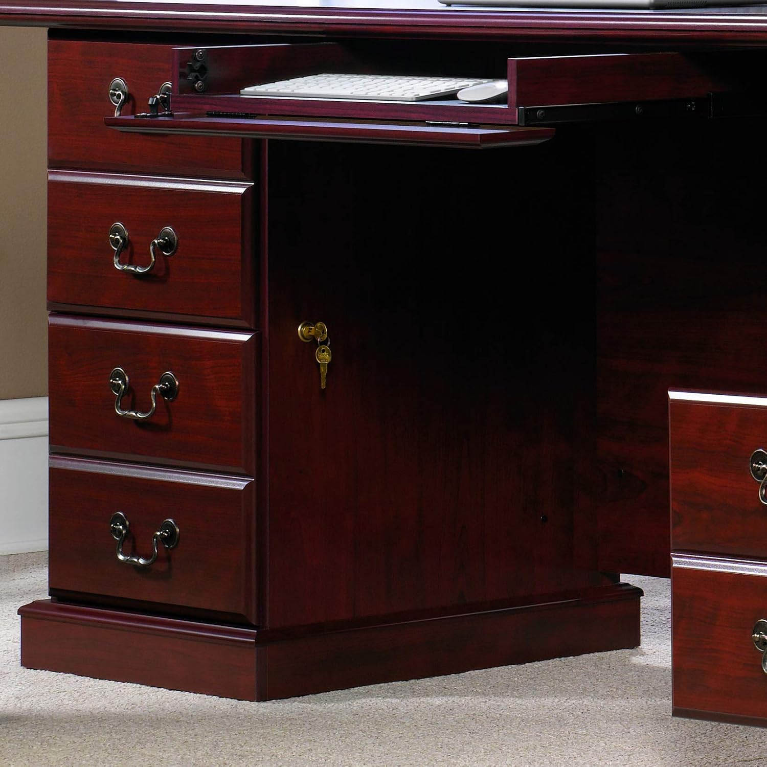 Close-up of the Sauder Heritage Hill Executive Desk's keyboard tray and locked file drawers