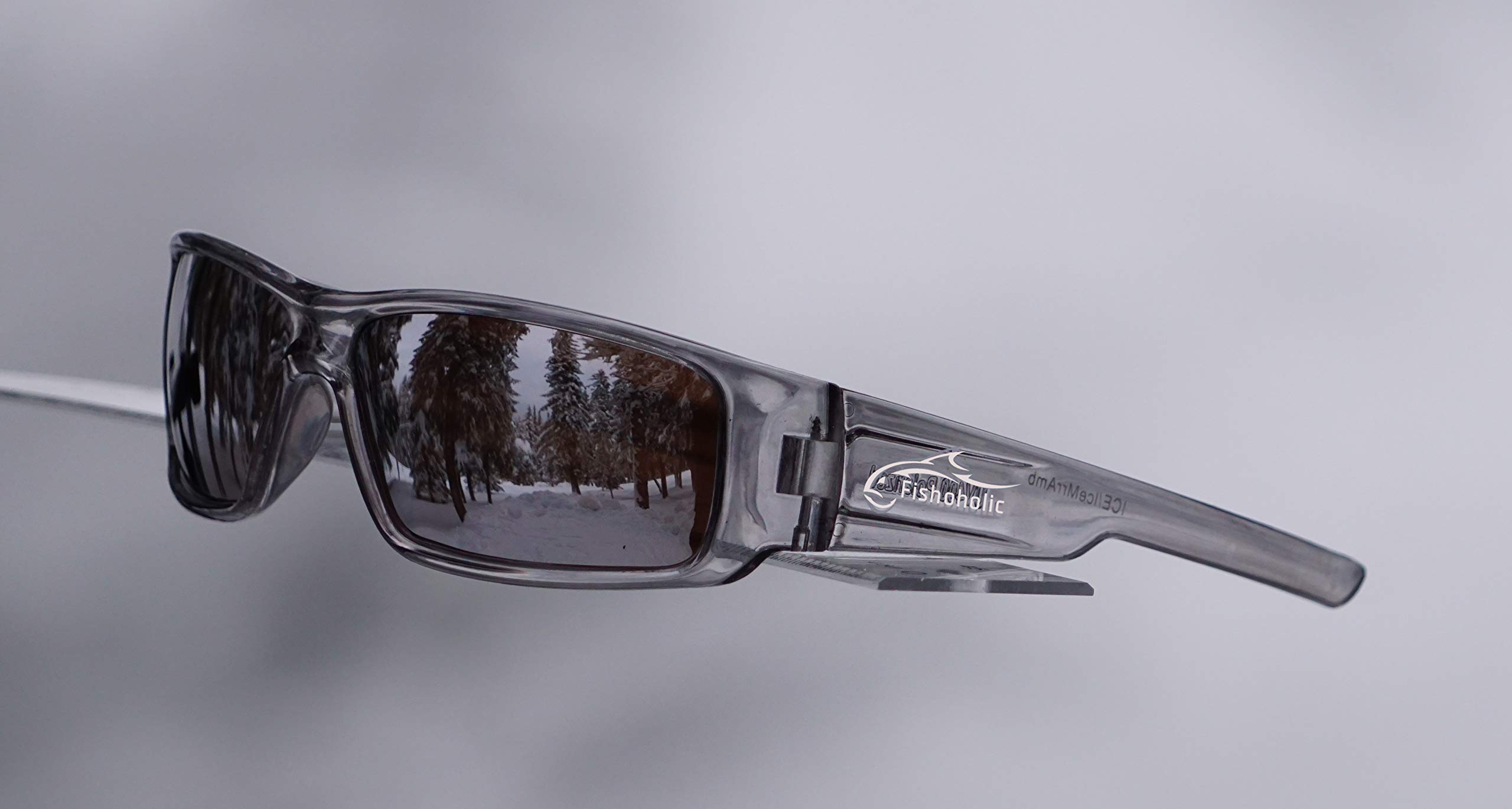 Gafas de sol polarizadas de pesca, marco semitransparente con lente de espejo plateado sobre base ámbar, frío como hielo