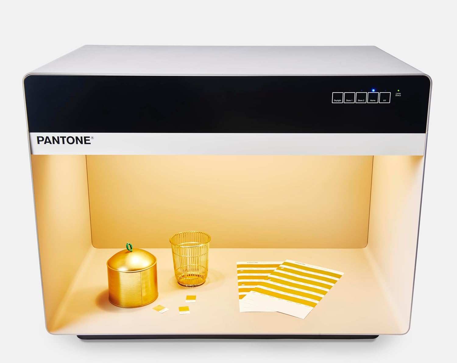 Pantone 5-Light Booth illuminating gold-colored objects under TL84 Store 2 setting.