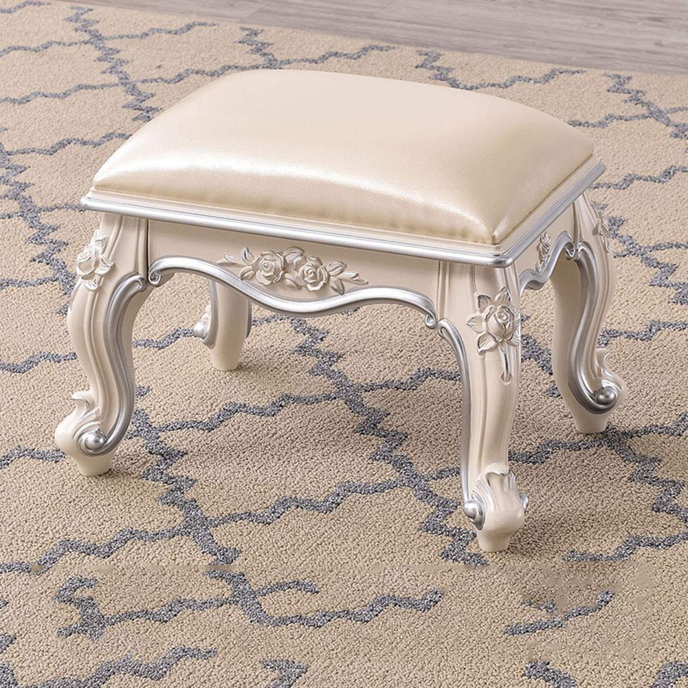 Tabouret de pied sculpté européen finitions dorées pour intérieur chic
