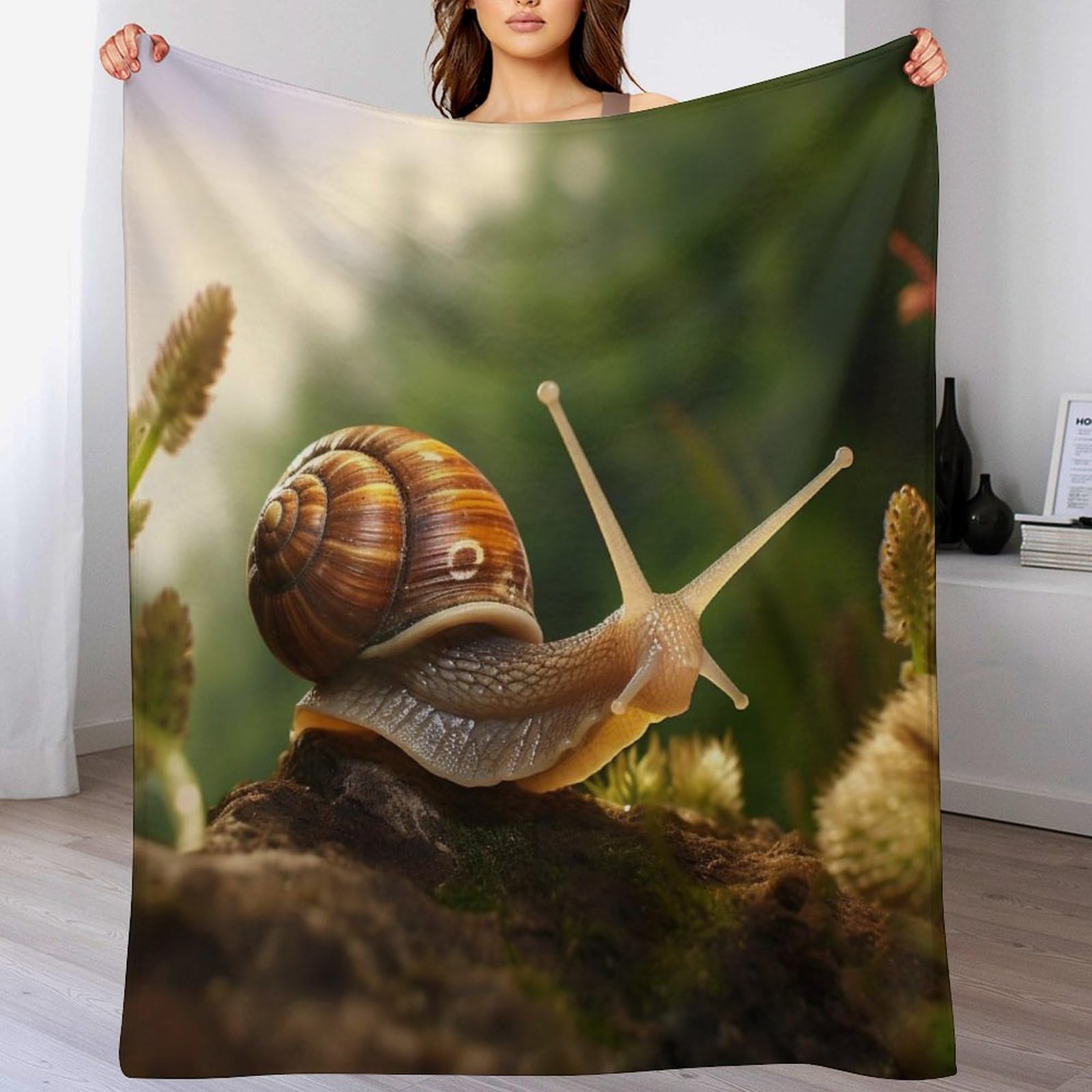 Couverture polaire escargots douce pour vos soirées cocooning sur le canapé du salon