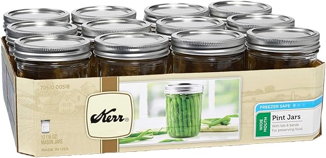 Kerr 27133144 Wide Mouth Pint Glass Mason Jars 16-Ounces with Lids and Bands 12-Count per (1-Case), cast-Iron, Clear
