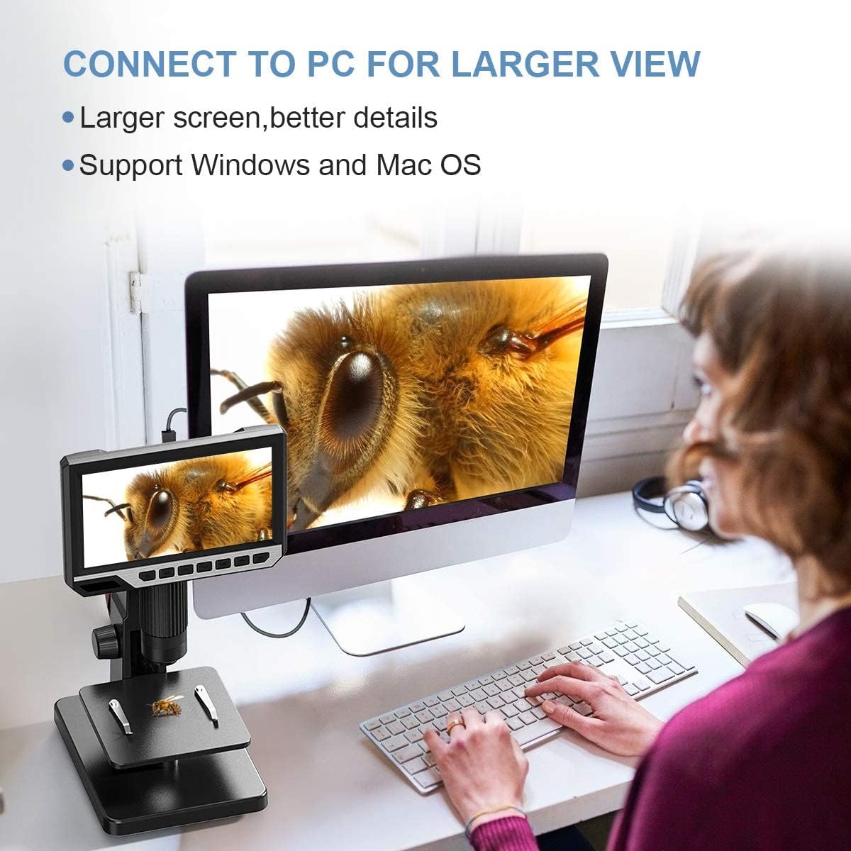 A person using the TOMLOV DM11 microscope connected to a desktop computer for a larger view of the magnified image.