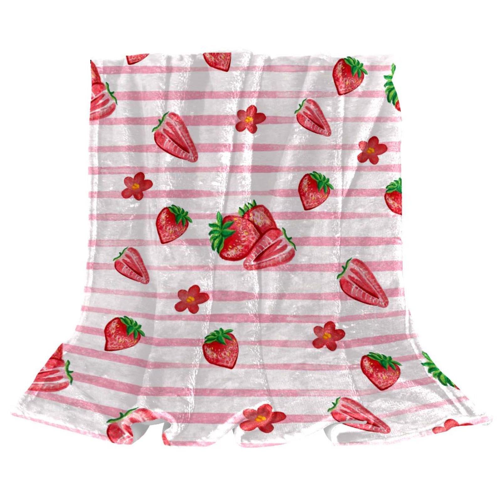 Couverture polaire fraises : plaid doux pour un hiver cocooning au canapé
