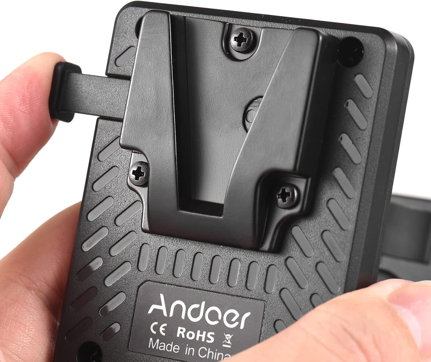 Close-up of the V-mount battery plate's safety lock and release mechanism