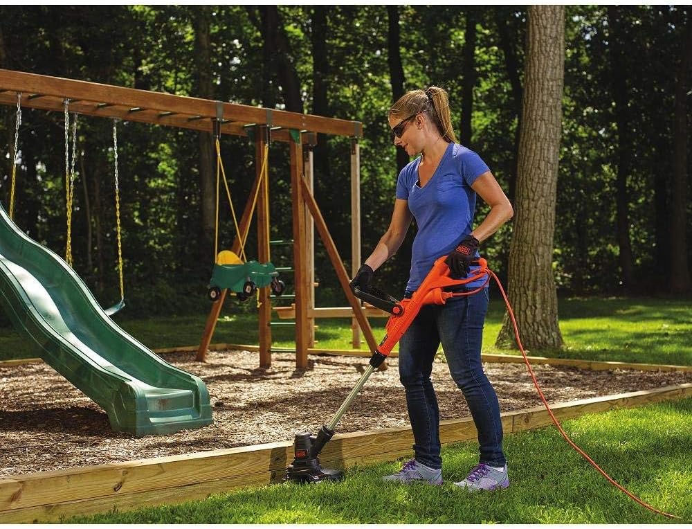 User operating BLACK+DECKER ST8600 string trimmer