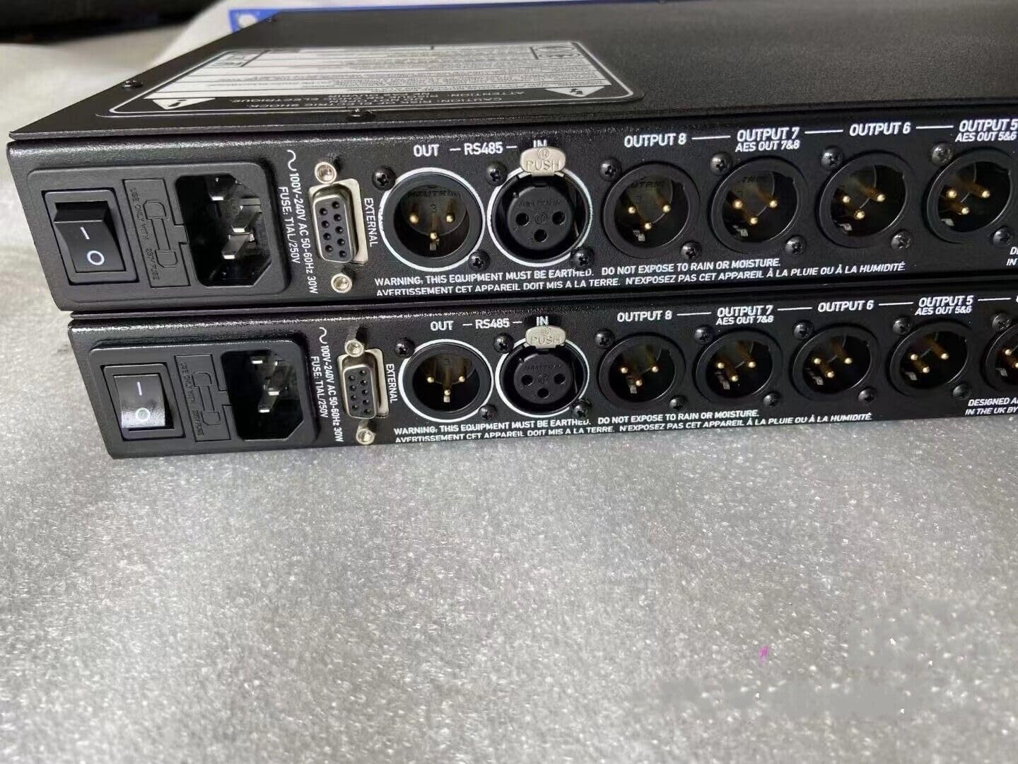 Rear panel of the XTA DP448 Audio Processor showing power input, RS485 ports, and various audio output connectors (AES/EBU and analog).