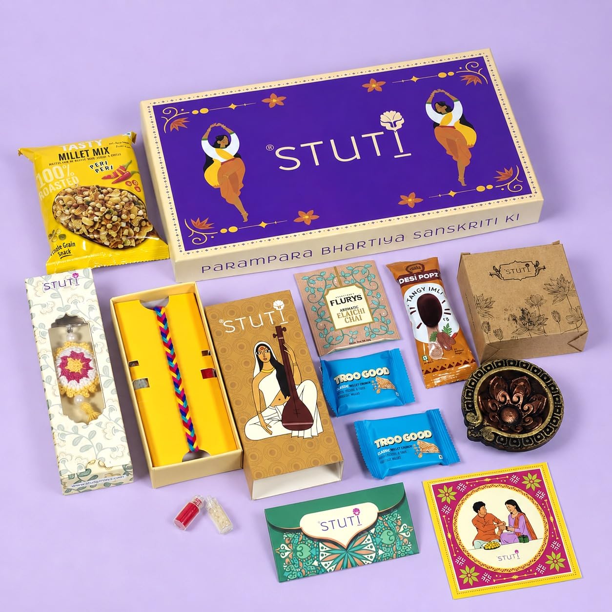 stuti yaadein rakhi gift for brother-9 inclusions combo of handmade cotton dori, sabudana papad, namkeen snacks, khakra, chai and more with complimentary roli & chawal | rakhi combo gift box