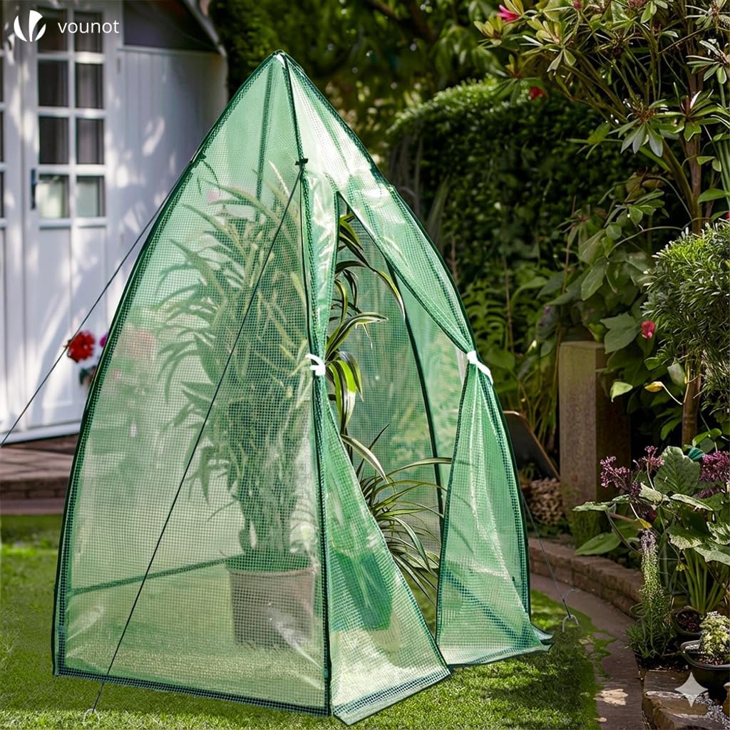 Assembled VOUNOT Dome Greenhouse in a garden setting with a plant inside.