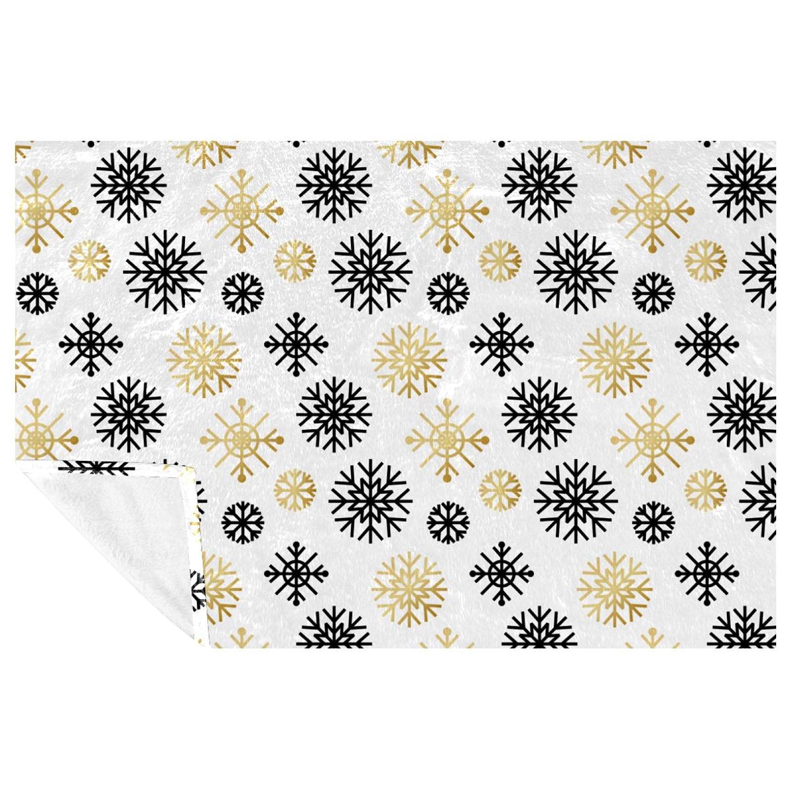 Couverture de Noël noire et dorée : l'accessoire cocooning de vos soirées d'hiver