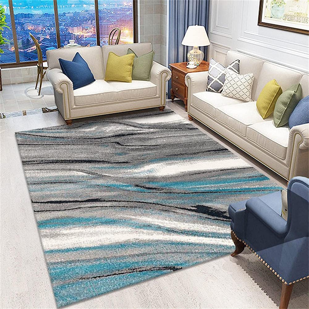 Tapis doux salon abstrait bleu ciel pour réchauffer un sol carrelé froid et impersonnel