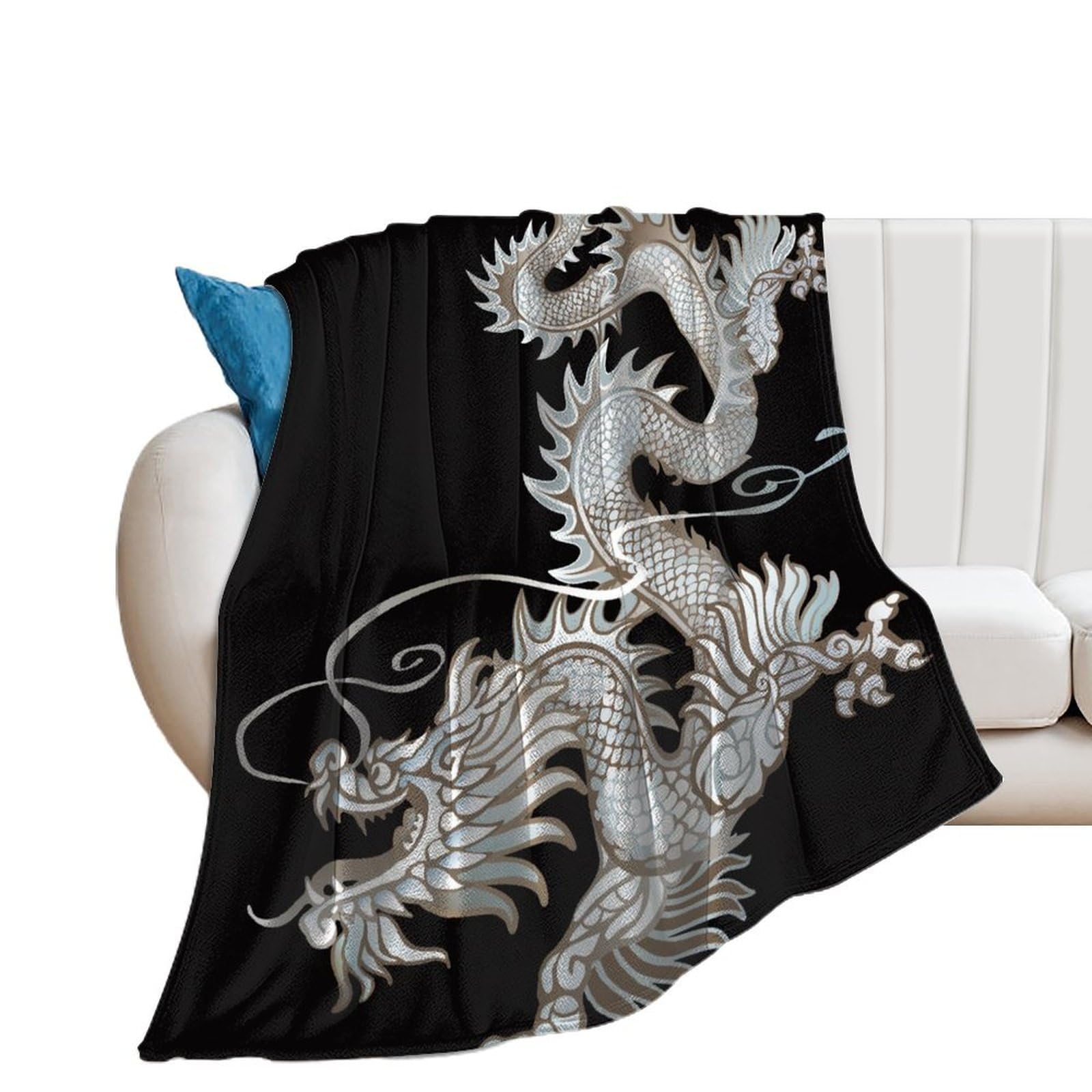 Couverture polaire dragon d'argent pour des soirées cocooning douillettes sur votre canapé