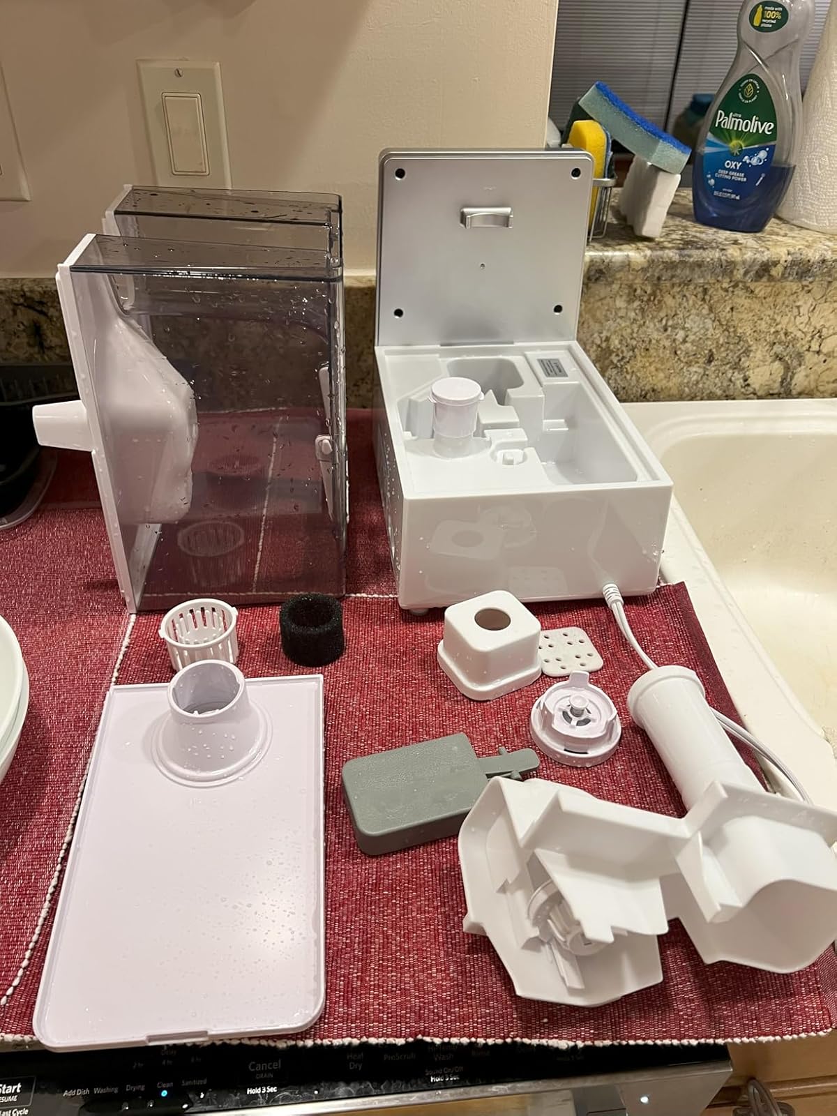 Disassembled humidifier parts showing cleaning complexity