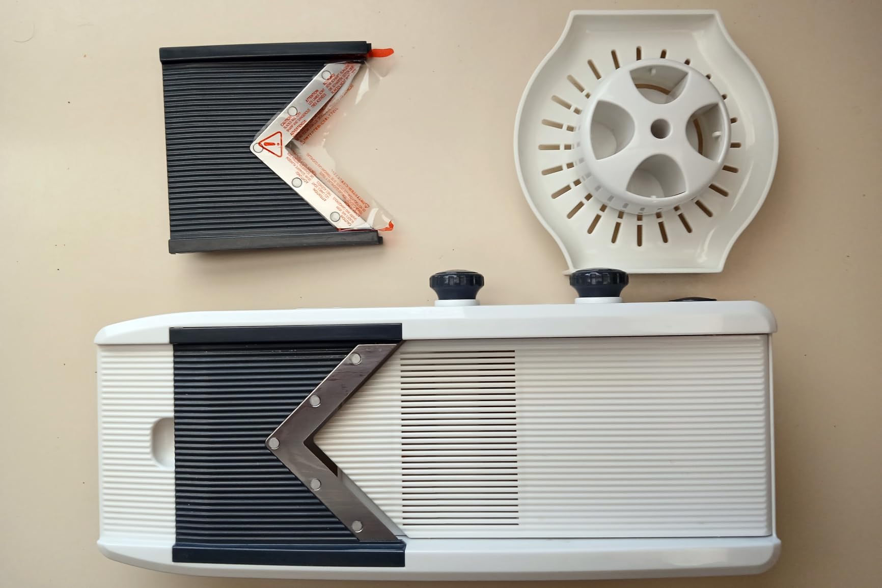Mueller V-Pro 5-Blade Mandoline Slicer with five interchangeable stainless steel blades laid out