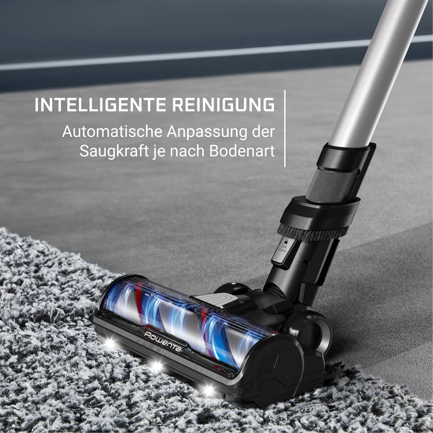 Detail kartáčové hlavy vysavače s rozsvícenými LED světly na koberci