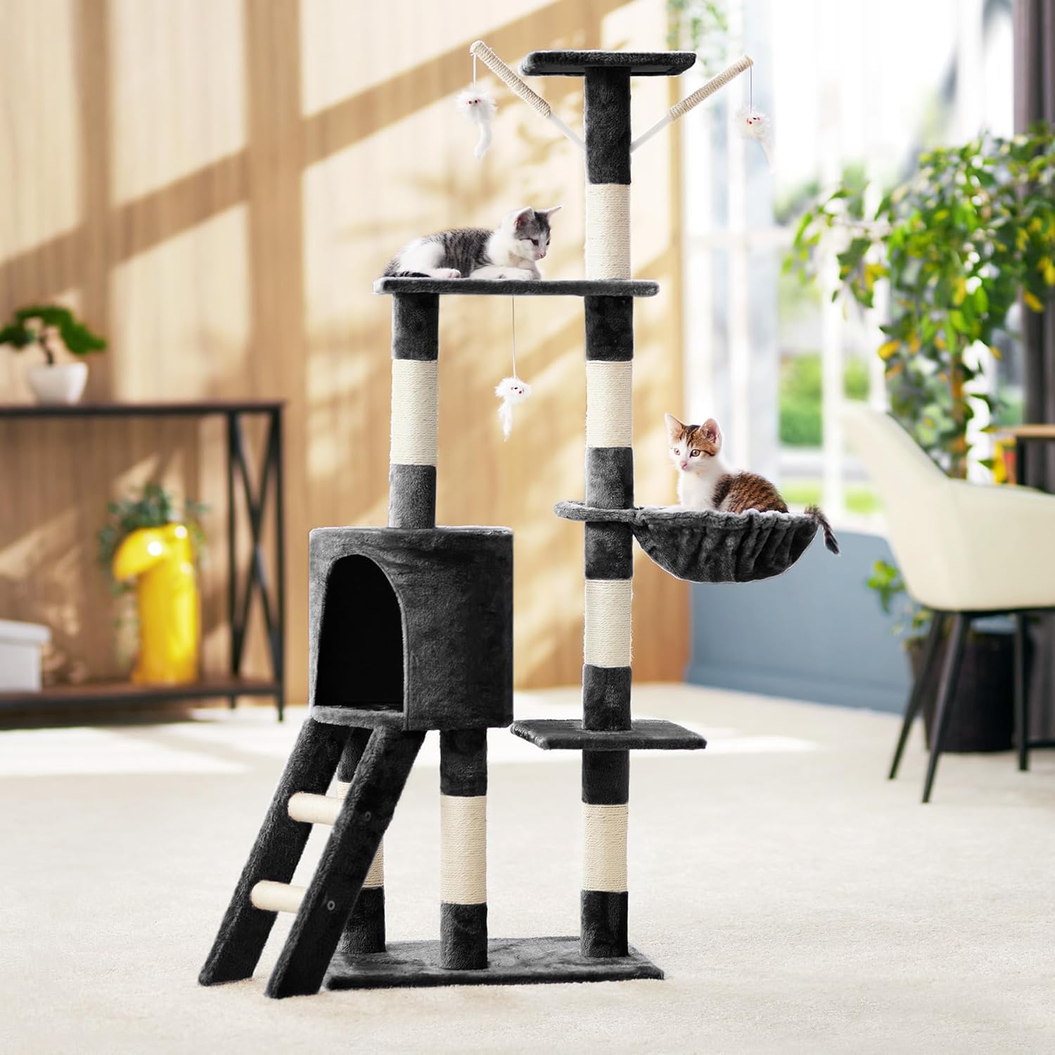 Two cats interacting with the tectake cat tree in a living room setting