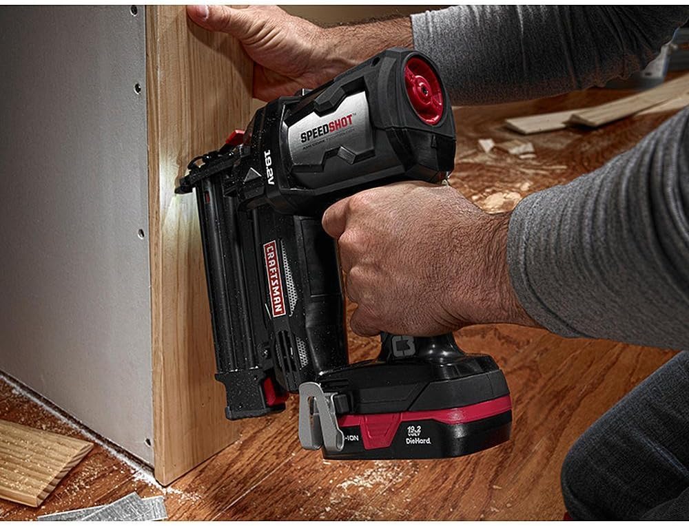 Craftsman C3 19.2V Brad Nailer in use, driving a nail into wood